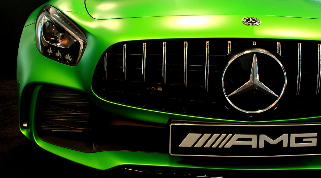 Close-up of a green Mercedes-AMG front grille and badge — premium vehicle parts and accessories